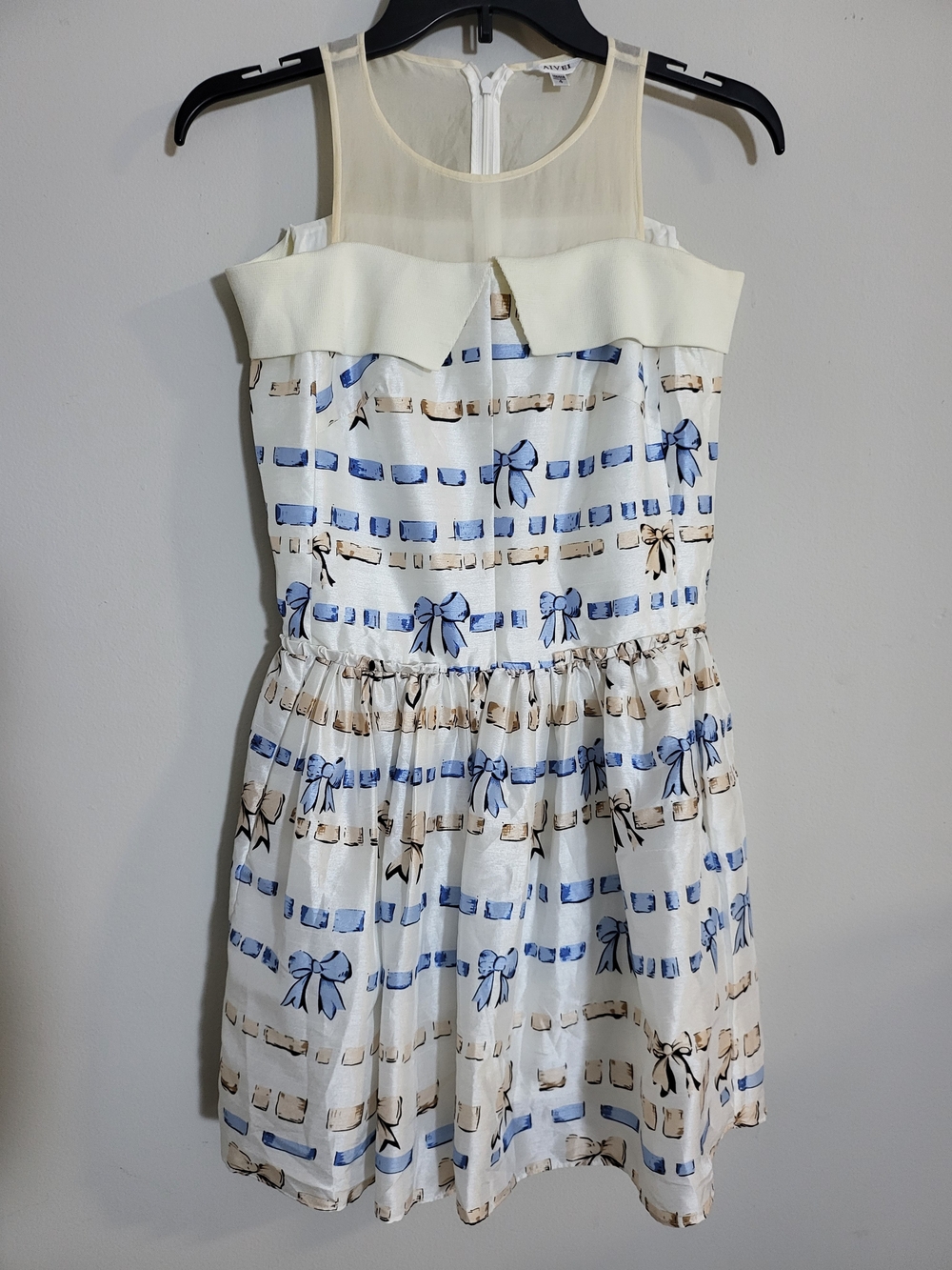Sleeveless Cream Dress with Blue Bow Prints
